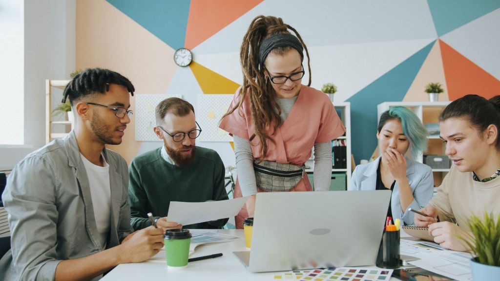Advisers reviewing a business plan together